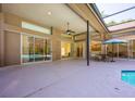 Covered patio provides ample space for outdoor seating and relaxation, overlooking the pool area at 3831 River Hollow Ct, Oviedo, FL 32765