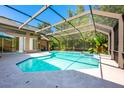 Spacious screened-in pool with ample deck space, offering a private outdoor oasis at 3831 River Hollow Ct, Oviedo, FL 32765