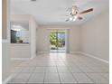 Bright living room featuring tiled floors and sliding glass doors to a balcony at 4403 Hector Ct # 3, Orlando, FL 32822