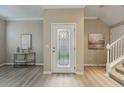 Foyer featuring wood floors, and a decorative glass front door at 5341 Via Appia Way, Sanford, FL 32771