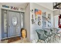 Cozy porch with chairs and decor, offering a welcoming space to relax and enjoy the neighborhood at 623 Green Meadow Ave, Maitland, FL 32751
