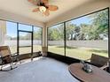 Comfortable screened-in patio featuring ample space and a ceiling fan for relaxing at 865 Bay Bridge Cir, Apopka, FL 32703