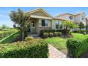 Charming single-story home featuring a well-maintained lawn and lovely landscaping at 10006 Quail Meadow Aly, Winter Garden, FL 34787