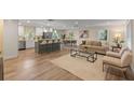 Open-concept living room, dining, and kitchen area with modern finishes at 1105 Lake Nettie Dr, Eustis, FL 32726