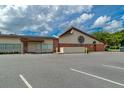 View of Tavares Public Library showcasing its architecture and ample parking space at 111 E Caroline St, Tavares, FL 32778