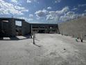 Image shows a new home's concrete block foundation with open space for a future garage at 1157 Basalt Ln, Sanford, FL 32771