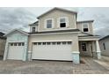 Two-story home featuring a three car garage and stone driveway at 1157 Basalt Ln, Sanford, FL 32771