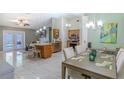 Open-concept dining and kitchen area featuring pendant lighting, tile floors, and modern appliances at 1161 Hackberry Dr, Orlando, FL 32825