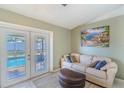 Cozy living room area with access to the pool, featuring comfortable seating and decor at 1161 Hackberry Dr, Orlando, FL 32825