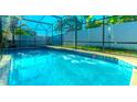 Sparkling screened-in pool with clear blue water, perfect for relaxation and outdoor entertainment at 1161 Hackberry Dr, Orlando, FL 32825