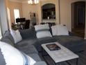 Spacious living room with a large sectional sofa and comfortable seating area, perfect for relaxing and entertaining at 143 Villa Di Este Ter # 205, Lake Mary, FL 32746
