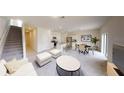 Bright and airy living room with an adjacent modern kitchen and dining area at 1433 Dalkeith Cv, Sanford, FL 32771