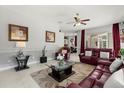 Spacious living room featuring comfortable seating, stylish decor, and an open floor plan at 14378 Stamford Cir, Orlando, FL 32826