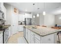Spacious kitchen featuring granite countertops, stainless steel appliances, and ample counter space at 1540 Softshell St, St Cloud, FL 34771