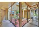 A quaint condominium courtyard with greenery, offering a tranquil outdoor space at 1908 Lake Atriums Cir # 3, Orlando, FL 32839