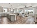 The open-concept living room is connected to the kitchen, creating a seamless flow for modern living at 2737 Serenity Meadow Dr, Kissimmee, FL 34744