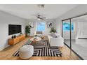 Bright living room featuring a modern black and white rug and stylish furniture at 553 Floral Dr, Kissimmee, FL 34743