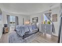 A serene main bedroom features soothing colors, a comfortable bed, and a scenic lake view window at 574 Orange Dr # 78, Altamonte Springs, FL 32701