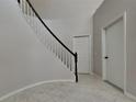 View of the interior staircase featuring white and black railing at 130 Circle Hill Rd, Sanford, FL 32773