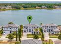 Waterfront home featuring lake access, beautiful landscaping, and serene surroundings for relaxed living at 16808 Bolsena Dr, Bella Collina, FL 34756