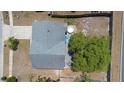 Aerial view of the backyard featuring a patio set, a covered structure, and a well-maintained lawn at 1848 Jimson Ave, Ocoee, FL 34761