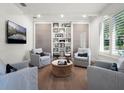 Inviting sitting room with built-in bookshelves and comfortable seating at 2171 Forrest Rd, Winter Park, FL 32789