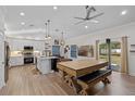 Open-concept layout showcases the kitchen and dining area with a blend of modern finishes at 2651 Sunrise Blvd, Mount Dora, FL 32757