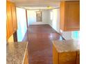 Spacious living room featuring wood floors and bright natural light at 311 E Bridgers Ave, Auburndale, FL 33823