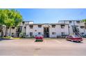 Exterior view of a two-story condo building with parking and covered stairways at 4117 S Semoran Blvd # 17, Orlando, FL 32822