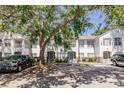 Inviting condominium exterior with multiple units, mature trees, and convenient parking available for residents and visitors at 4340 S Kirkman Rd # 901, Orlando, FL 32811