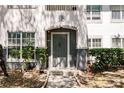 Inviting condo front door with a stylish gray paint, modern hardware, and well-maintained landscaping at 4340 S Kirkman Rd # 901, Orlando, FL 32811