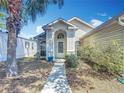 Inviting home with a well-kept lawn and a cozy front entrance at 50989 Highway 27 # 174, Davenport, FL 33897