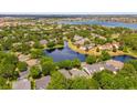 Expansive aerial view showcasing the neighborhood's serene water features and lush greenery at 8440 Woburn Ct, Windermere, FL 34786