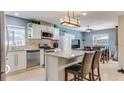 Modern kitchen featuring stainless steel appliances, granite countertops, and a stylish island at 8606 Lsu Ln, Orlando, FL 32817