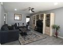 Cozy living room features modern decor, gray walls, and hardwood floors at 9313 Pavillion Dr, Orlando, FL 32825