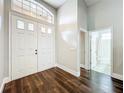 Bright and spacious foyer with high ceilings, featuring beautiful dark hardwood floors at 10356 Stone Glen Dr, Orlando, FL 32825