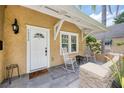 Inviting front porch with white rocking chairs, slate tiles, and cozy decor at 1333 W Yale St, Orlando, FL 32804