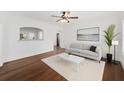 A decorated living room featuring hard wood floors, white walls and ample space at 1333 W Yale St, Orlando, FL 32804