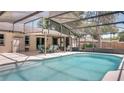 Gorgeous pool area with screened-in lanai and outdoor dining space at 1510 Jaguar Cir, Apopka, FL 32712