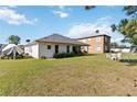 Spacious backyard with a patio area perfect for outdoor entertaining, and ample lawn space at 20335 Macon Pkwy, Orlando, FL 32833
