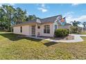 Attractive single-story home with a well-manicured lawn, arched windows, and a welcoming entrance at 20335 Macon Pkwy, Orlando, FL 32833