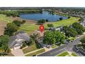 Aerial view of the home on the golf course with a lake view at 2780 Highland View Cir, Clermont, FL 34711