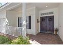 Charming front entrance with double doors and a brick walkway at 2780 Highland View Cir, Clermont, FL 34711