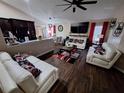 Spacious living room features sleek hardwood floors and contemporary decor at 2979 Cool Breeze Cir, St Cloud, FL 34769