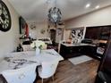 Open-concept dining and living area with stylish furnishings and modern lighting at 2979 Cool Breeze Cir, St Cloud, FL 34769