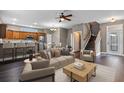 Open concept living room with modern decor, dark wood flooring, and stairs at 41 E Spruce St, Orlando, FL 32804
