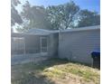 Cozy home with a screened-in porch and a modest, fenced backyard at 435 N Observatory Dr, Orlando, FL 32835