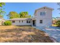 Charming two-story home featuring a cozy entrance and a well-kept lawn at 4805 Okeefe St, Orlando, FL 32808