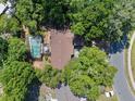 Aerial view of the home featuring a screened-in pool and lush, green landscaping at 5709 Breskin Dr, Orlando, FL 32839
