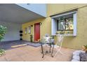 Cozy front patio with bistro set, plants, and attractive exterior at 7484 Canford Ct # 8, Winter Park, FL 32792